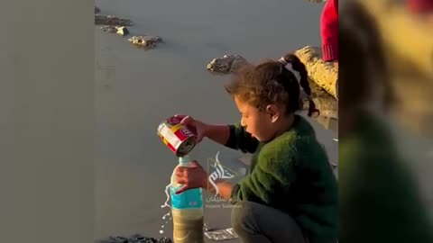 Children in Gaza collecting rainwater amid water scarcity in the strip