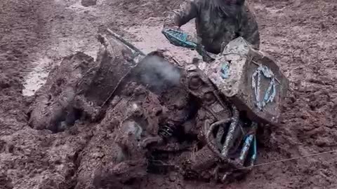 ATV Gets Stuck in Mud Pit
