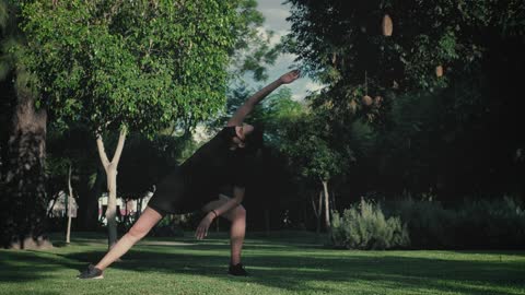 Girl doing stretching in nature