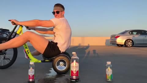 Guy uses Drifting Tricycle to Kick off Bottle Cap