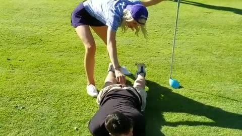 Girl golfs off mans butt