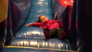 Collab copyright protection - kid in pink falling down slide