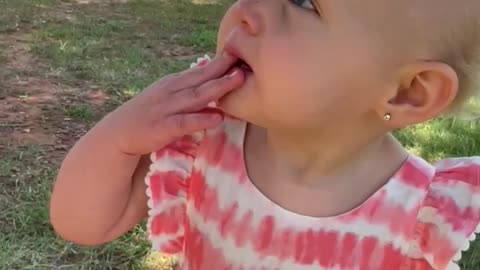 Little girl screams in excitement over a squirrel