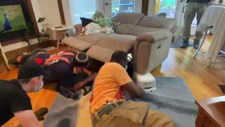 Firefighters Rescue Dog Trapped in Recliner
