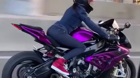 Sweet girl rides purple bike