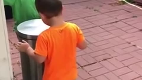Kids Jokingly Hit Each Other With Trash Can's Lid by Stepping on It's Pedal