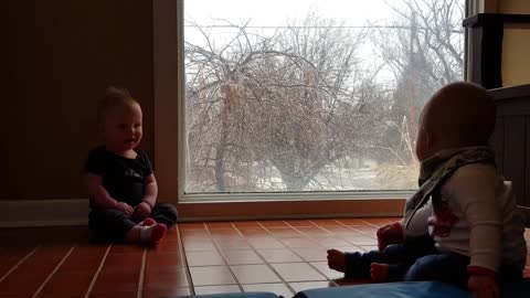 Snowfall sends twins into giggle fit