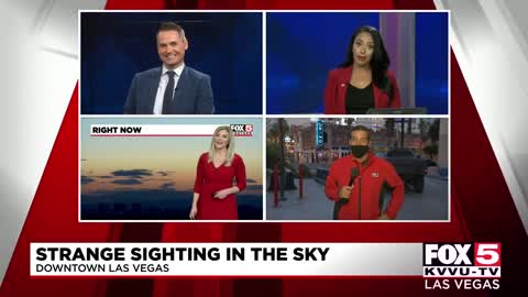 Cameraman captures UFO sighting while filming news broadcast!