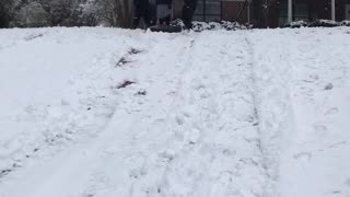 Man in all black falls off snowbaord