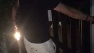 Man almost jumps over balcony falls back