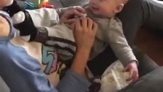 Baby's first laugh is a real kick in the face!