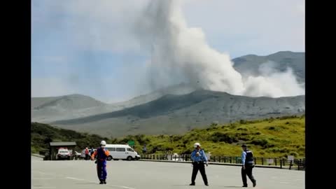 Japanese volcano spews plumes of ash, people warned away.