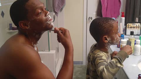 Boy Joins His Dad For A Bonding Moment Over Grooming