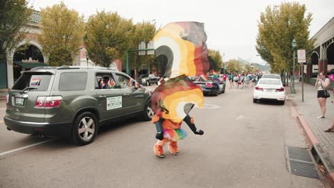 Man In A Suit Performing In A Parade
