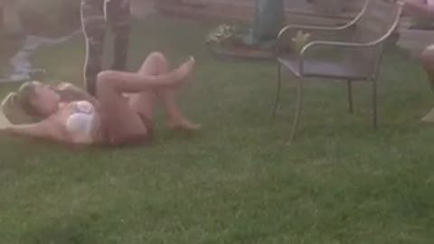 Girl back flip off back yard chair