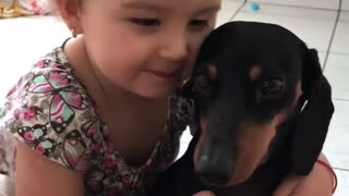 Little Girl Loves Her Puppy
