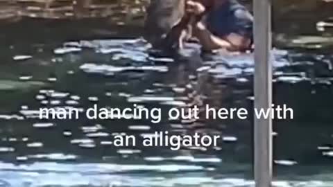 Man dance with crocodile