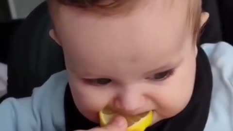 So cute....Watch the baby's reaction after tasting the lemon