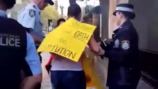 A mother protesting against Covid-19 lockdown in Australia is arrested in front of her crying child
