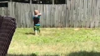 A Small Boy Playing Catch with his Neighbour's Dog