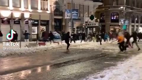 Epic community snowball fight in Madrid, Spain