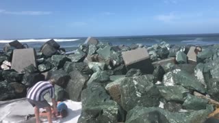 Kid Gets Swept off His Feet by Ocean