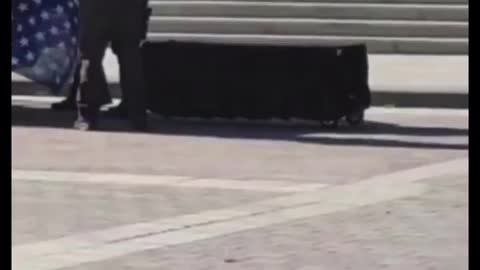 Coffin in front of capitol