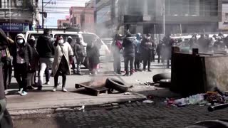 Tear gas and flames in Bolivia black market raid