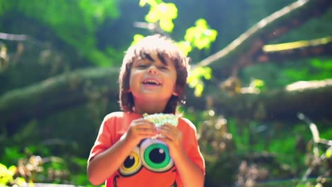 happy kid jumping in forest steadycam shot slow motion Children