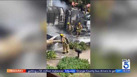 FIRE...City trash truck bursts into flames, chars parked cars
