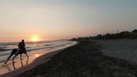 Horseback riding on a tropical beach along the coast of the Ocean