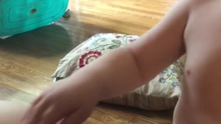 Big brother makes baby sister laugh