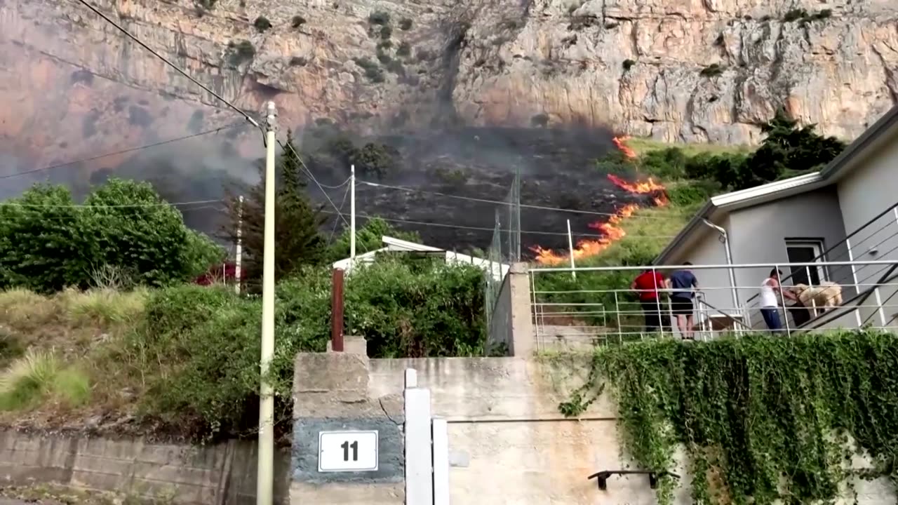 People watch as Palermo wildfire approaches homes