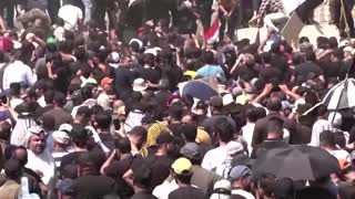 Moqtada al-Sadr supporters pull down Baghdad blast wall