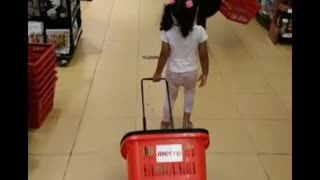 Toddler doing grocery shopping