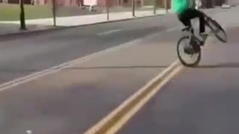 Kids on bicycles playing chicken with cars