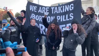 Pro-Choicers Take Abortion Pills On The Steps Of The Supreme Court
