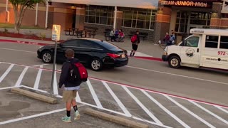 Mom with Microphone Gives Son Advice at School Drop Off