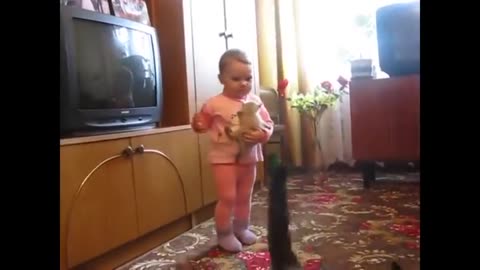 Mother cat snatches crying kitten from toddler