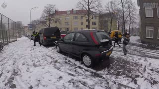 Police offices participates in playful snowball fight