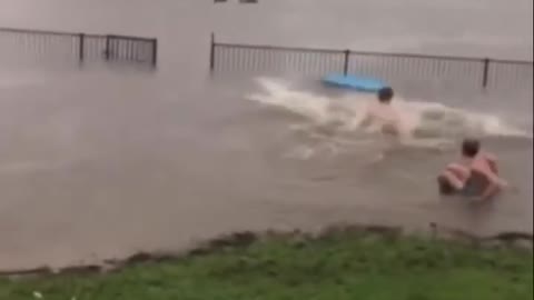 Kids Attempt to Jump Over Rail Half Submerged Under Water While Surfing