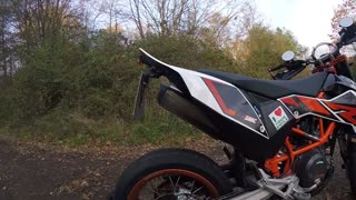 Orange moto backroad wheelie