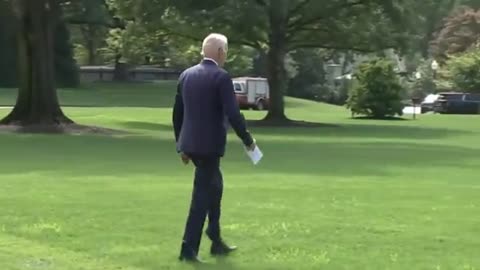 Biden SMIRKS while awkwardly walking like a robot