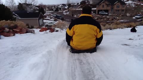 Ride the driveway slide in the snow! Almost made it to the end!