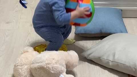 Pretty baby plays with her ball