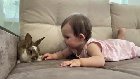 Baby_Feeding_a_Rabbit_