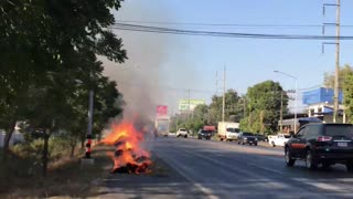 Truck Leaves Trail of Burning Bales