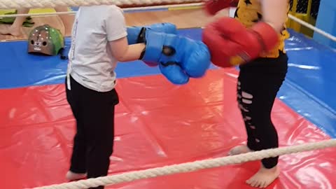 Children practice boxing