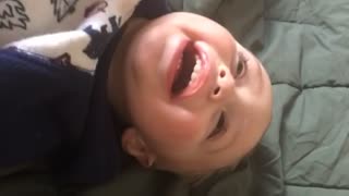 Little boy laughs