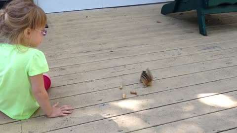 Pearl Feeding A Chipmunk At The Cottage (2014)